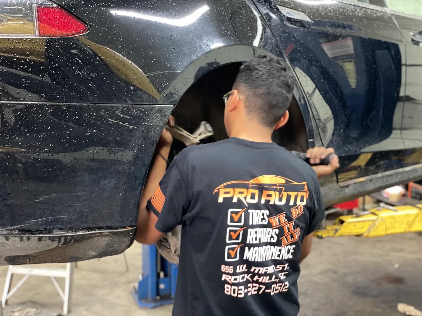 Pro Auto Shop technician working on a vehicle
